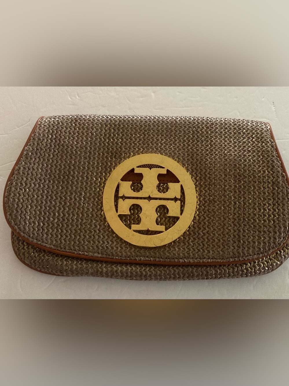 Tory Burch Brown/Gold Woven metallic body,fold over Clutch with big Gold Emblem